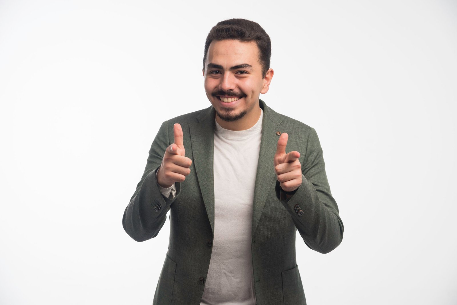 A businessman in dress code pointing a good job A businessman in dress code pointing a good job. High quality photo